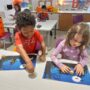 Preschool students at The Children's School play a math game as a part of their new math curriculum.